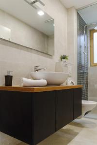 a bathroom with a sink and a mirror at Apartments Bikin in Brela +81 photos
