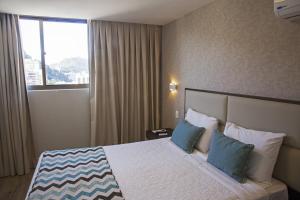 Кровать или кровати в номере Mirador Rio Copacabana Hotel