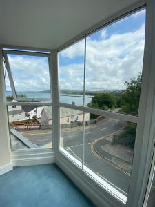 a room with a window with a view of a street at Rose and Crown in Goodwick