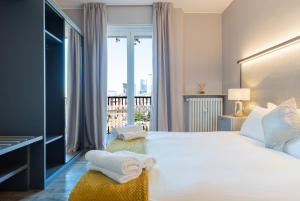 Кровать или кровати в номере Milan Retreats