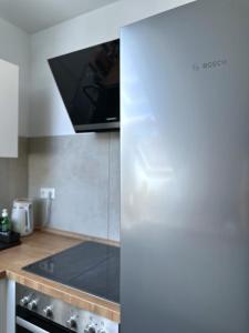 Televízia a/alebo spoločenská miestnosť v ubytovaní SKYLINE Penthouse Apartment - Luxus & Zentral