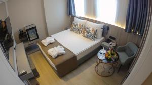 Postel nebo postele na pokoji v ubytování Alessia Hotel