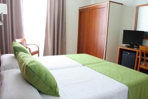 Ein Bett oder Betten in einem Zimmer der Unterkunft Hotel Pujol