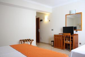 Ein Bett oder Betten in einem Zimmer der Unterkunft Hotel Pujol