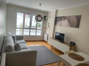 TV a/nebo společenská místnost v ubytování Apartamento vacacional foz