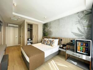 TV a/nebo společenská místnost v ubytování Alessia Hotel