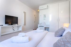 Ein Bett oder Betten in einem Zimmer der Unterkunft Adriatic Queen Residence
