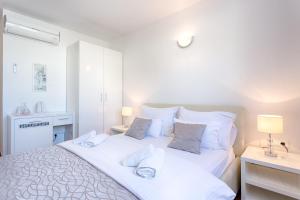 Ein Bett oder Betten in einem Zimmer der Unterkunft Adriatic Queen Residence