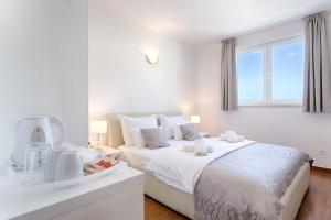 Ein Bett oder Betten in einem Zimmer der Unterkunft Adriatic Queen Residence