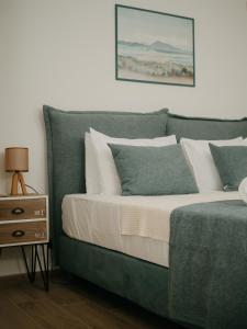 Posteľ alebo postele v izbe v ubytovaní Lenko Bianco Studio by Estia