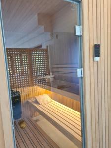 a sauna with a bench inside of a room at Holiday Resort Zlatni Dol Mostar in Goranci