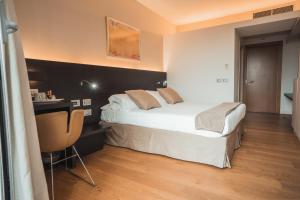 Postel nebo postele na pokoji v ubytování Mod 05 Bike Hotel