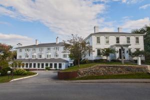 a large white house with a road in front of it at The Federal in Brunswick