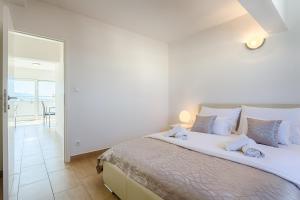 Ein Bett oder Betten in einem Zimmer der Unterkunft Adriatic Queen Residence