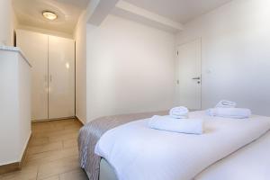 Ein Bett oder Betten in einem Zimmer der Unterkunft Adriatic Queen Residence