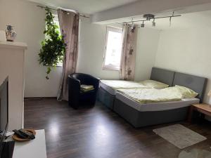 Postel nebo postele na pokoji v ubytování Gästehaus Linden