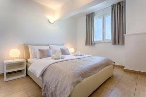 Ein Bett oder Betten in einem Zimmer der Unterkunft Adriatic Queen Residence