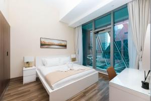 Ένα ή περισσότερα κρεβάτια σε δωμάτιο στο SIMPLY COMFORT in J ONE Tower