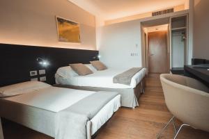 Postel nebo postele na pokoji v ubytování Mod 05 Bike Hotel