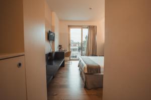 Postel nebo postele na pokoji v ubytování Mod 05 Bike Hotel