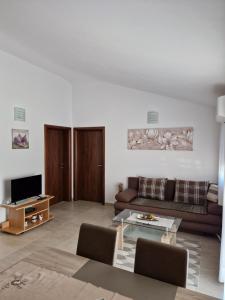 a living room with a couch and a table at Villa Luka in Barbariga