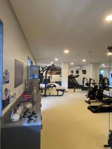 a gym with treadmills and exercise equipment in a room at Flat luxo torre 07 Eco Resort Praia dos Carneiros in Tamandaré