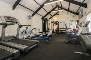 a gym with several treadmills and cardio machines at Manorcombe 2 in Callington