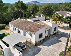 an aerial view of a house with a car parked in front at Villa Paraiso in Jávea