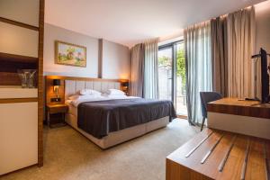 Posteľ alebo postele v izbe v ubytovaní Hotel Tonanti