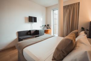 TV a/nebo společenská místnost v ubytování Mod 05 Bike Hotel