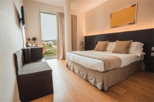 Postel nebo postele na pokoji v ubytování Mod 05 Bike Hotel