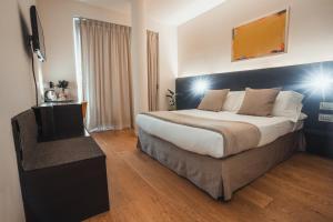 Postel nebo postele na pokoji v ubytování Mod 05 Bike Hotel