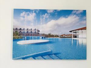a large swimming pool with a fountain in the middle at Residencial Lela d'Fermina in Pombas
