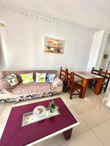 a living room with a couch and a table at Albania Dream Apartment 31 in Metogjashta