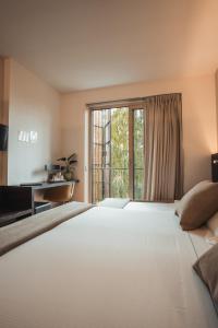 Postel nebo postele na pokoji v ubytování Mod 05 Bike Hotel