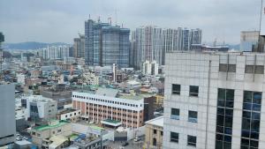 a view of a city with tall buildings at For you House in Daegu