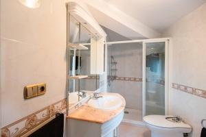 a bathroom with a sink and a shower at Casa Bella Lalin- 4 Double bedroom Galician Country Home! in Pontevedra