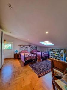 a bedroom with a bed and chairs in a room at BarberinoRelax in Barberino di Mugello