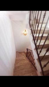a staircase in a building with a stair case at Spanish Villa in Torre del Rame