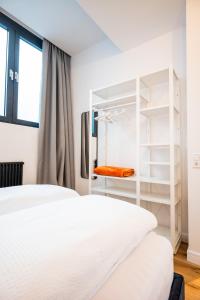 Postel nebo postele na pokoji v ubytování Apartments Leopold Ferdinand
