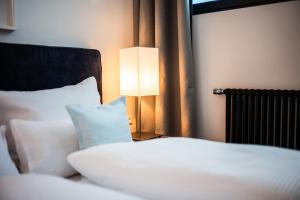 Postel nebo postele na pokoji v ubytování Apartments Leopold Ferdinand