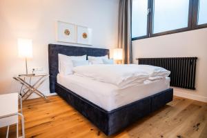 Posteľ alebo postele v izbe v ubytovaní Apartments Leopold Ferdinand