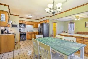 a kitchen and dining room with a table and chairs at Long Beach Hideaway Walk to Beach, Shops and Bars! in Long Beach