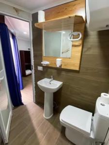 a bathroom with a toilet and a sink at Sliema - Double Room in Sliema