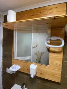 a bathroom with a mirror and a sink at Sliema - Double Room in Sliema