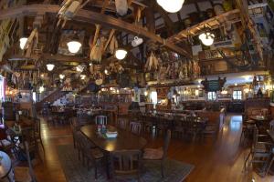 a bar with wooden tables and chairs in a room at Alte Brauerei Kasbachtal in Kasbach-Ohlenberg