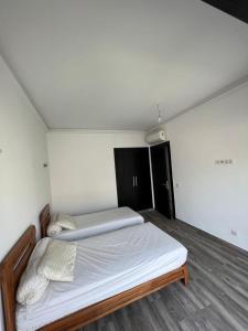 Ein Bett oder Betten in einem Zimmer der Unterkunft Duplex Taghazout Bay