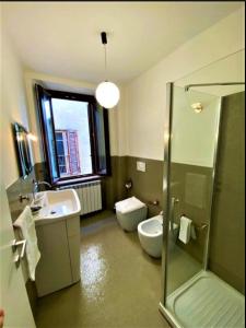 a bathroom with a sink and a toilet and a shower at Casa Vittorio Emanuele in Fiuggi