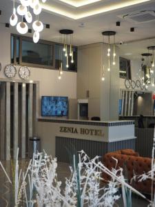 a lobby of a hotel with chandeliers at Zenia Hotel in Antalya