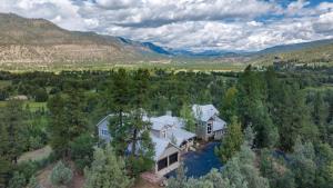 an aerial view of a large house in the woods at 575 County Road 253 in Durango